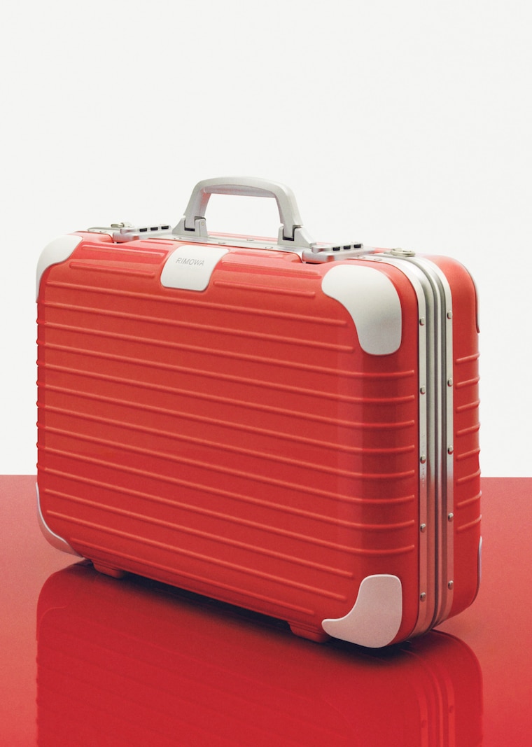 Vintage Suitcases in Blue, Red, and Yellow - RIMOWA's