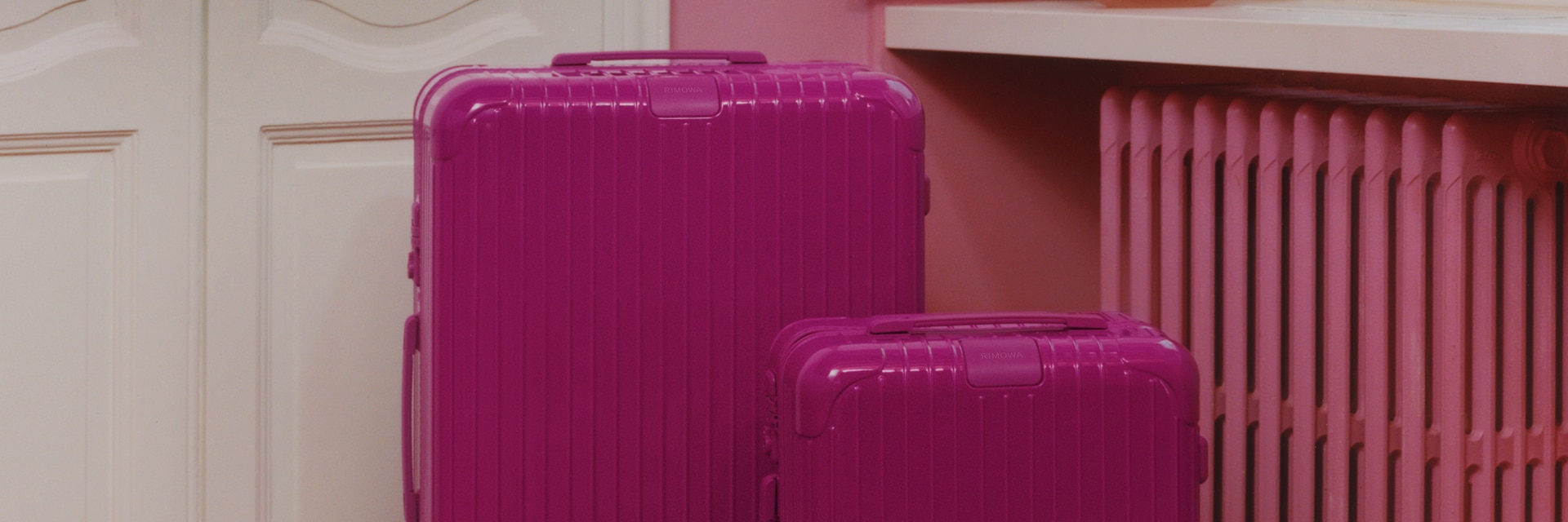 Magenta RIMOWA suitcases