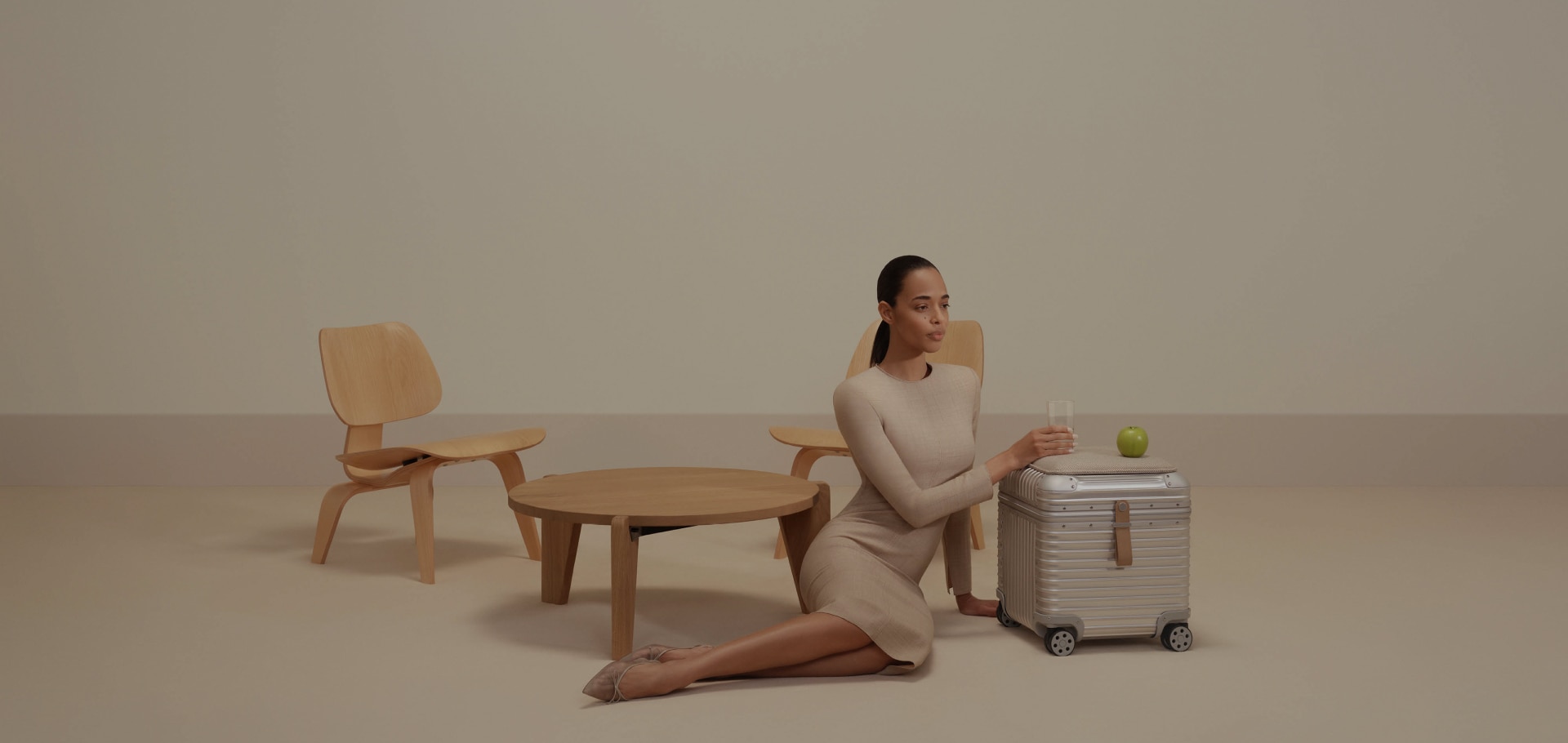 Picture of model with RIMOWA Vitra Aluminium Stool