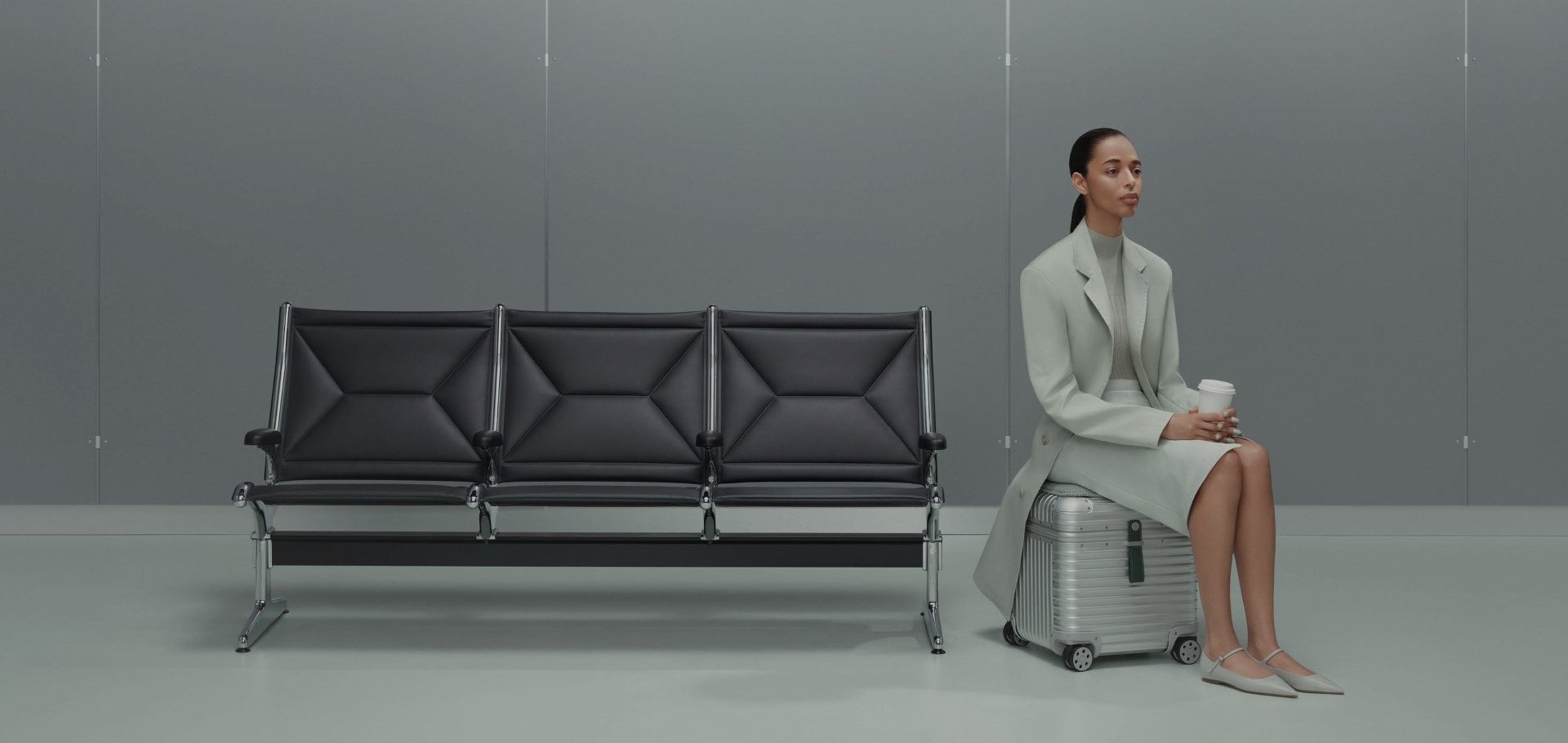 Picture of model with RIMOWA Vitra Aluminium Stool Picture of model with RIMOWA Vitra Aluminium Stool