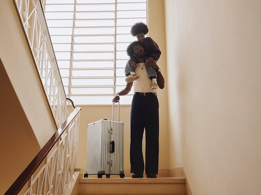 Picture of a father carrying his son on his back