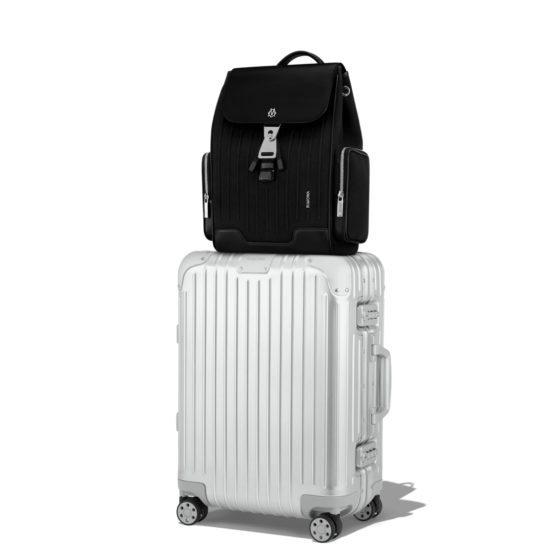 Never Still Small Flap Backpack in Leather & Canvas - Black | RIMOWA