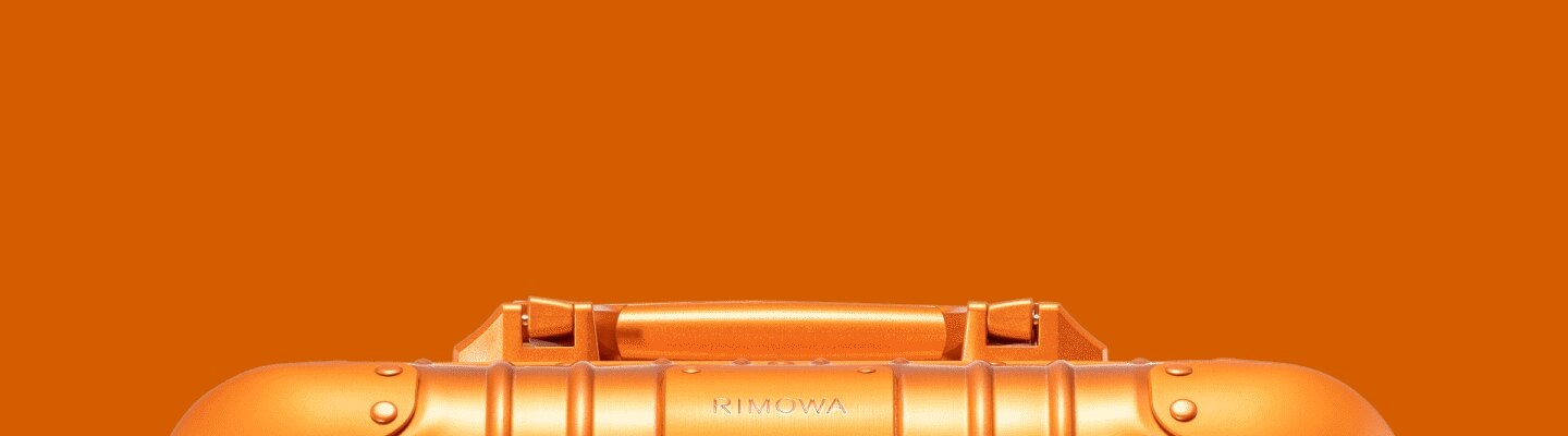 Orange suitcases & bags